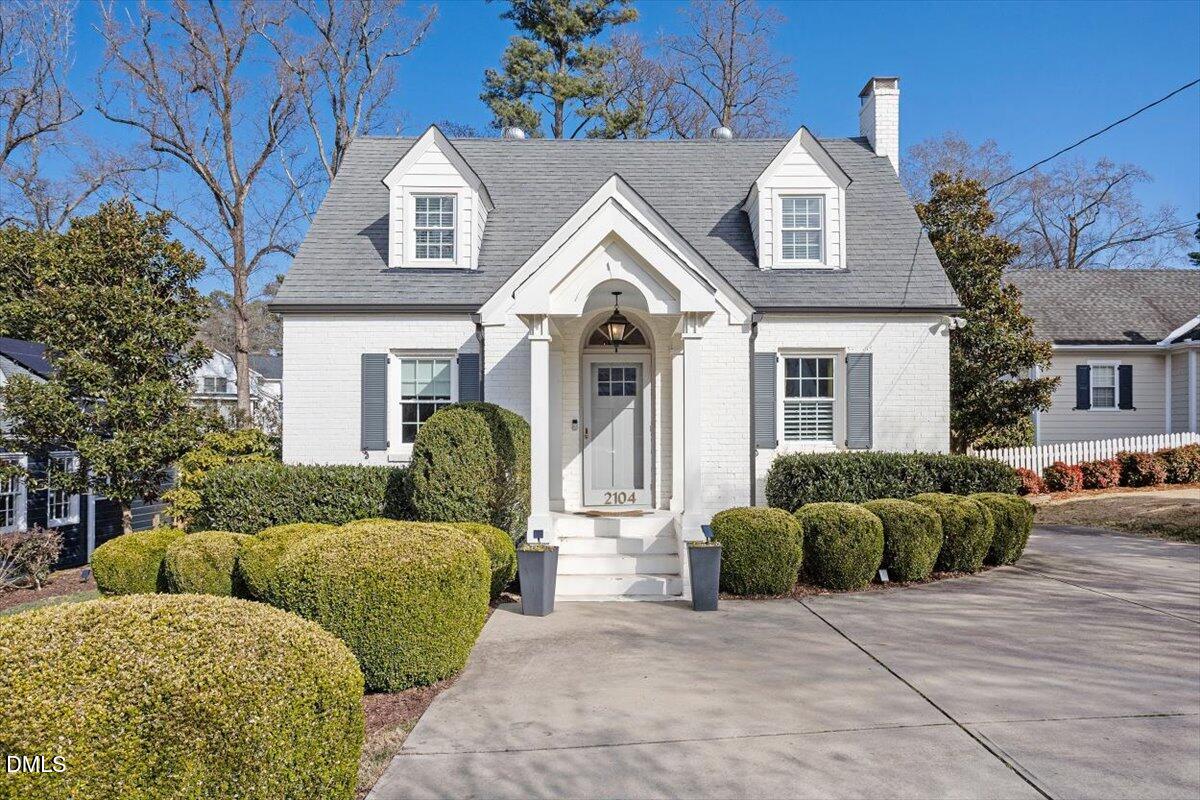2104 Reaves Drive Raleigh, NC 27608 - Photo 1 of 29 a view of a house with a garden