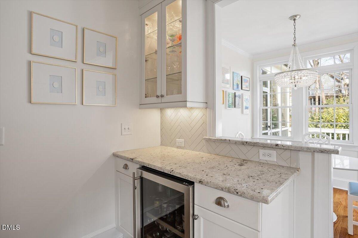 2104 Reaves Drive Raleigh, NC 27608 - Photo 13 of 29 a kitchen with stainless steel appliances granite countertop a sink and a granite counter tops