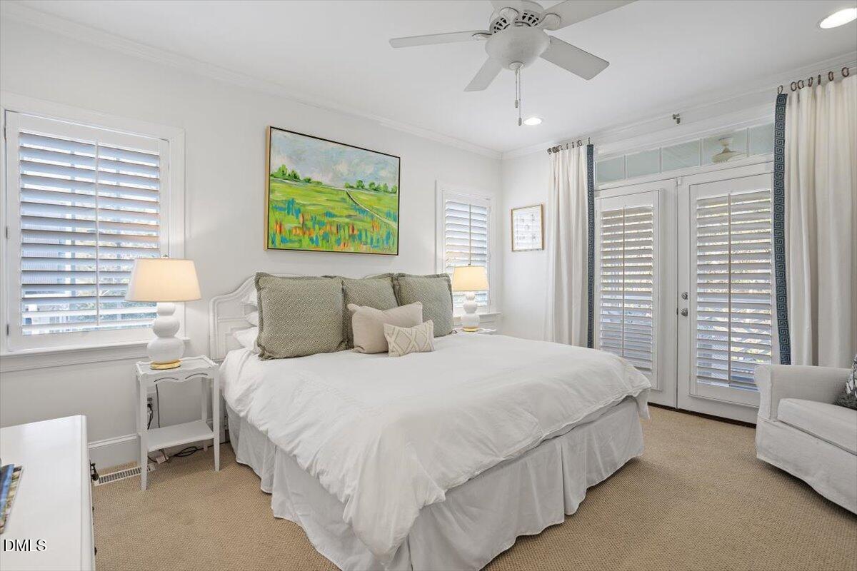 2104 Reaves Drive Raleigh, NC 27608 - Photo 18 of 29 a bedroom with a bed and a couch