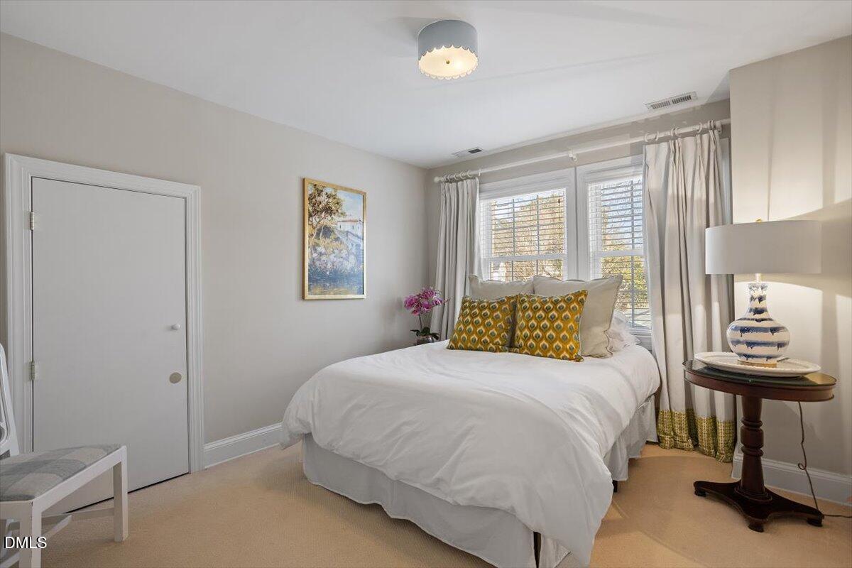 2104 Reaves Drive Raleigh, NC 27608 - Photo 23 of 29 a bedroom with a bed and a window