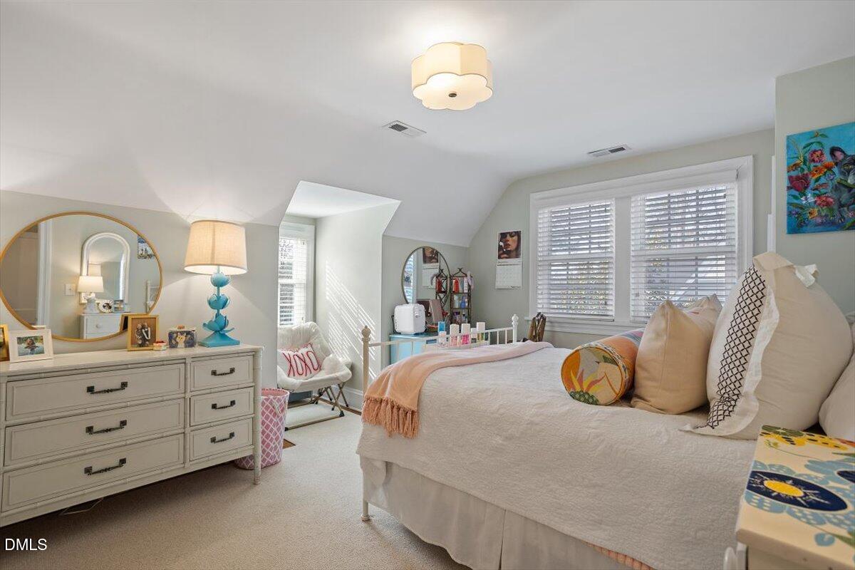 2104 Reaves Drive Raleigh, NC 27608 - Photo 25 of 29 a bedroom with bed and window
