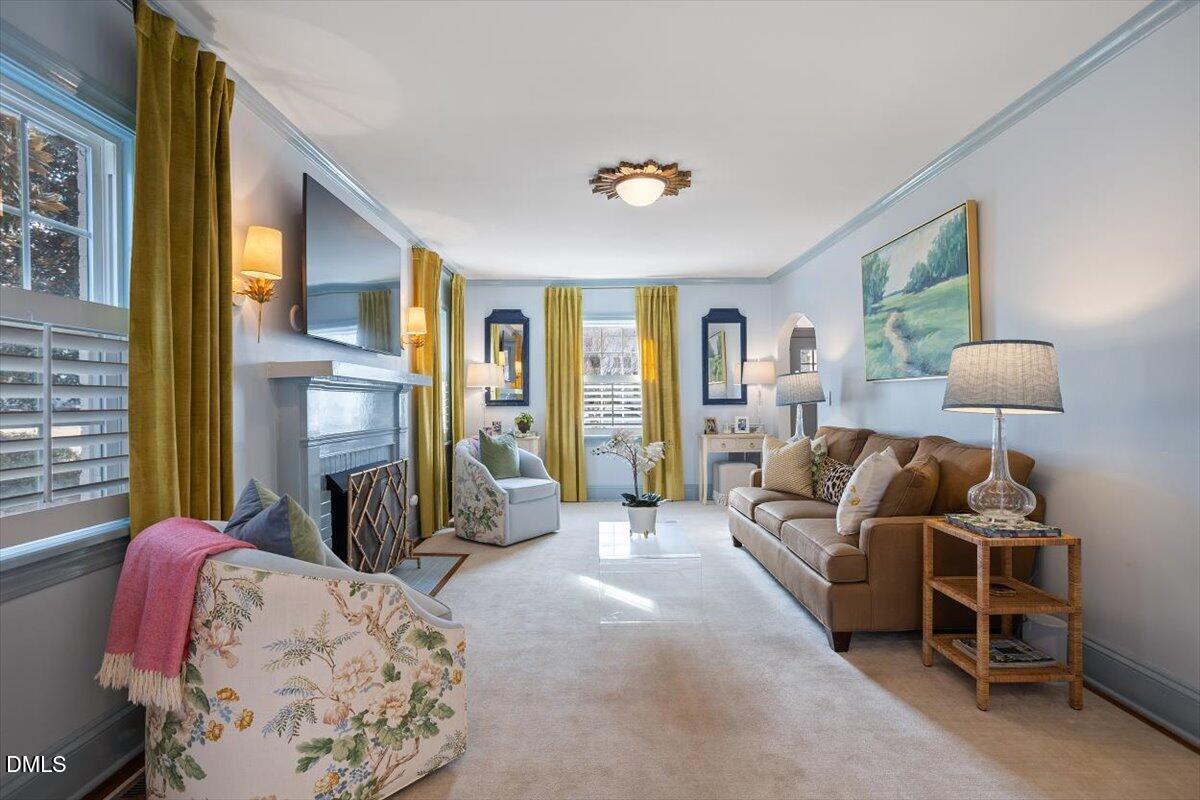 2104 Reaves Drive Raleigh, NC 27608 - Photo 7 of 29 a spacious bedroom with a bed and a couch