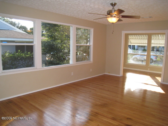 1759 Mayfair Road Jacksonville, FL 32207 - Photo 3 of 17 a view of an empty room with a window and wooden floor