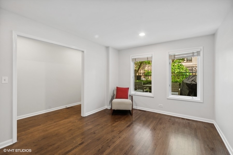 1455 South Indiana Avenue Chicago, IL 60605 - Photo 11 of 27 a hallway with window and wooden floor