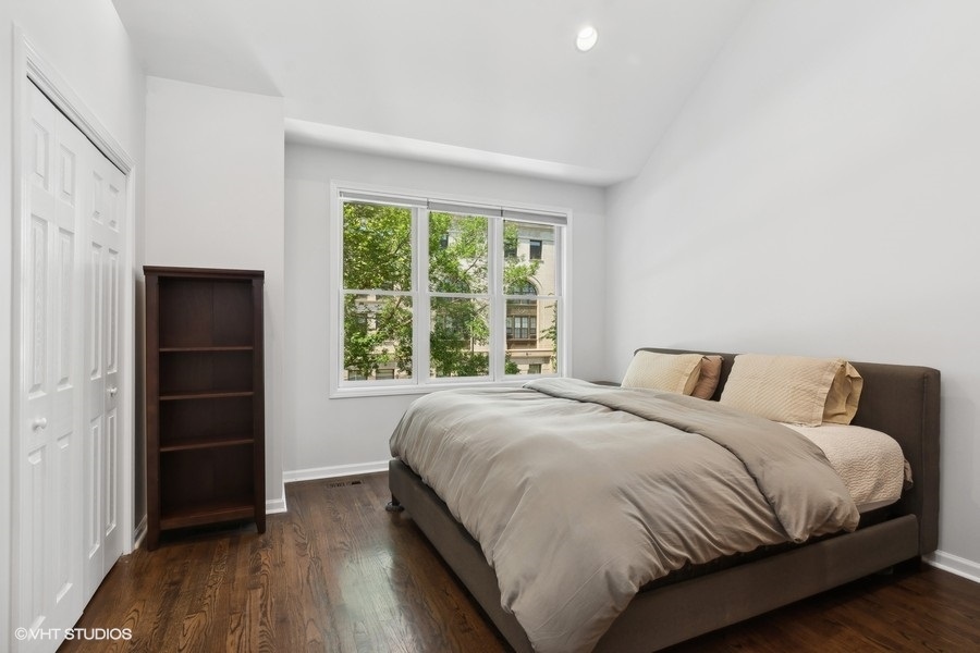 1455 South Indiana Avenue Chicago, IL 60605 - Photo 14 of 27 a bedroom with a bed and a window