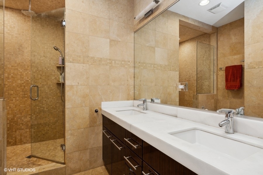 1455 South Indiana Avenue Chicago, IL 60605 - Photo 16 of 27 a bathroom with a sink and a mirror
