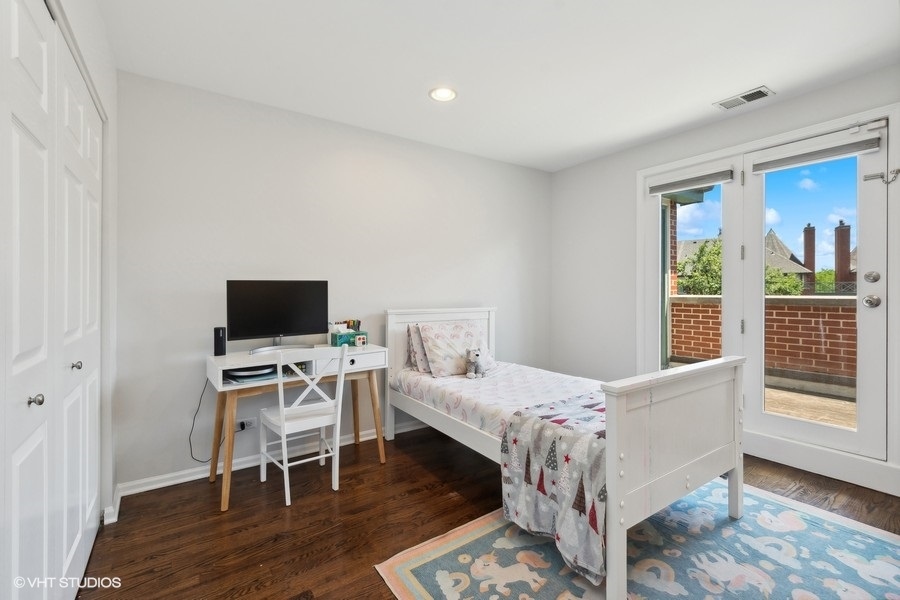 1455 South Indiana Avenue Chicago, IL 60605 - Photo 19 of 27 a bedroom with a bed and a flat screen tv