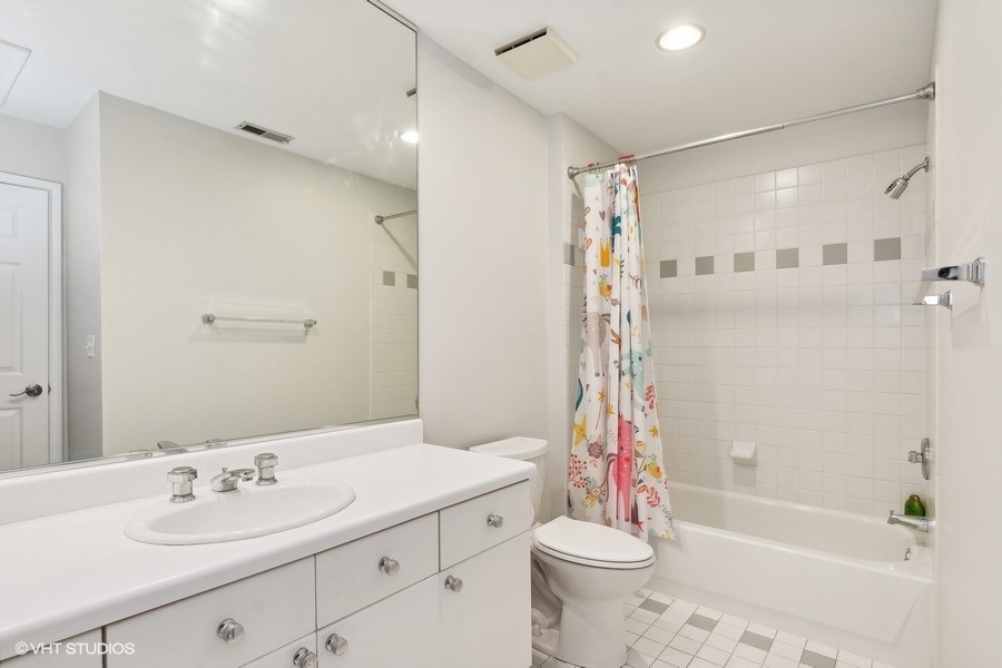 1455 South Indiana Avenue Chicago, IL 60605 - Photo 21 of 27 a bathroom with a sink toilet tub and shower
