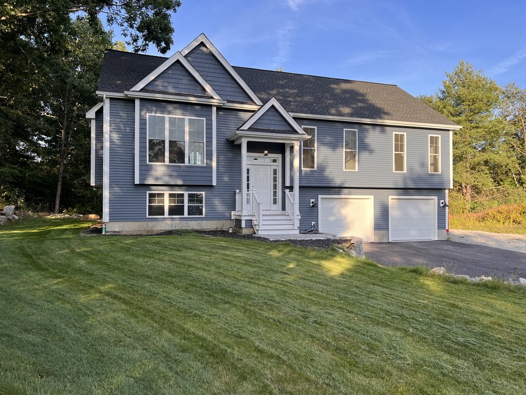 41 Brookside Avenue Webster, MA 01570 - Photo 1 of 17 a front view of a house with a yard