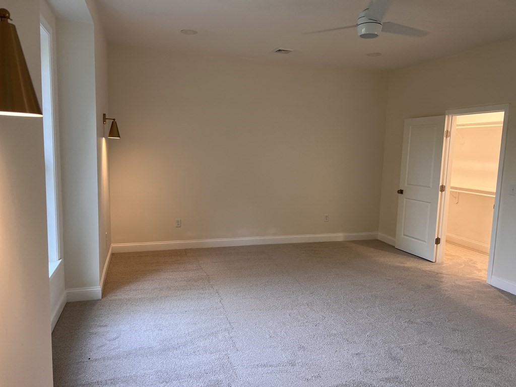 41 Brookside Avenue Webster, MA 01570 - Photo 11 of 17 an empty room with a empty space and a window