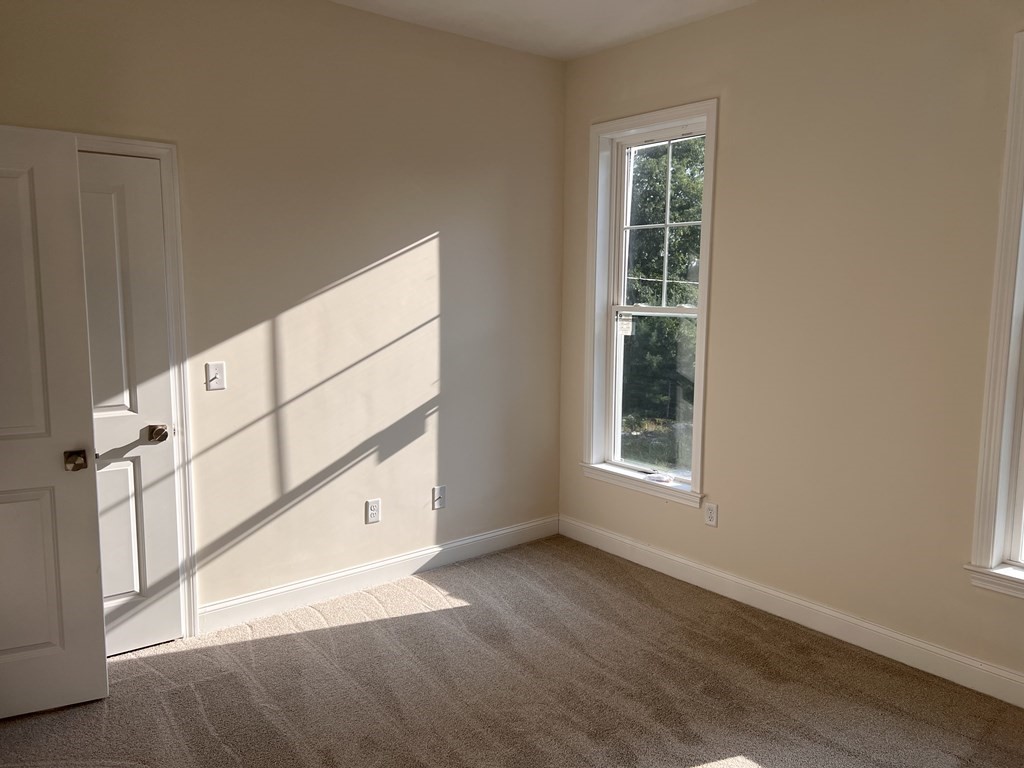 41 Brookside Avenue Webster, MA 01570 - Photo 13 of 17 a view of an entryway with wooden floor and windows