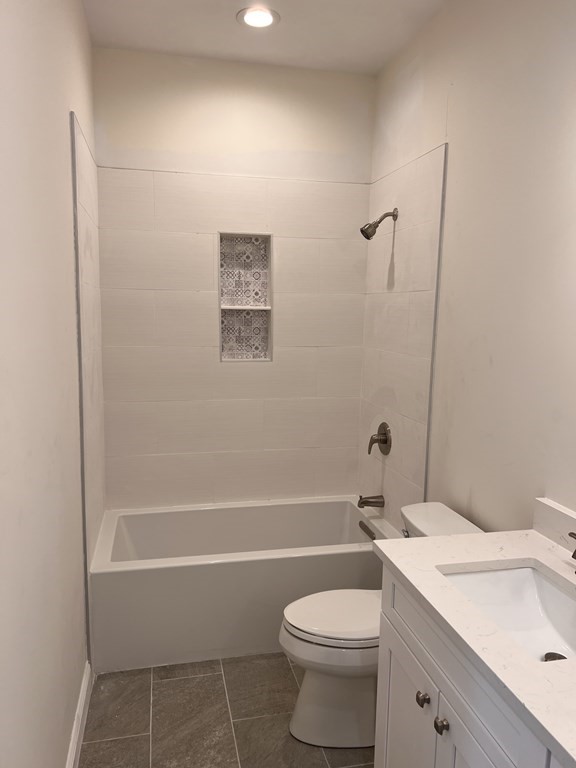41 Brookside Avenue Webster, MA 01570 - Photo 15 of 17 a bathroom with a toilet a sink and bathtub