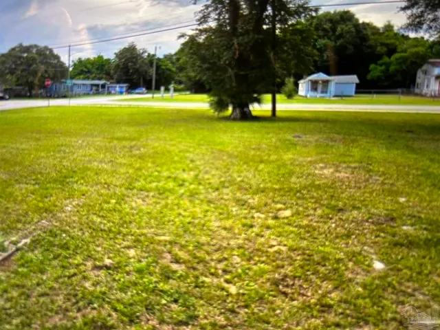 a house view with swimming pool in front of it