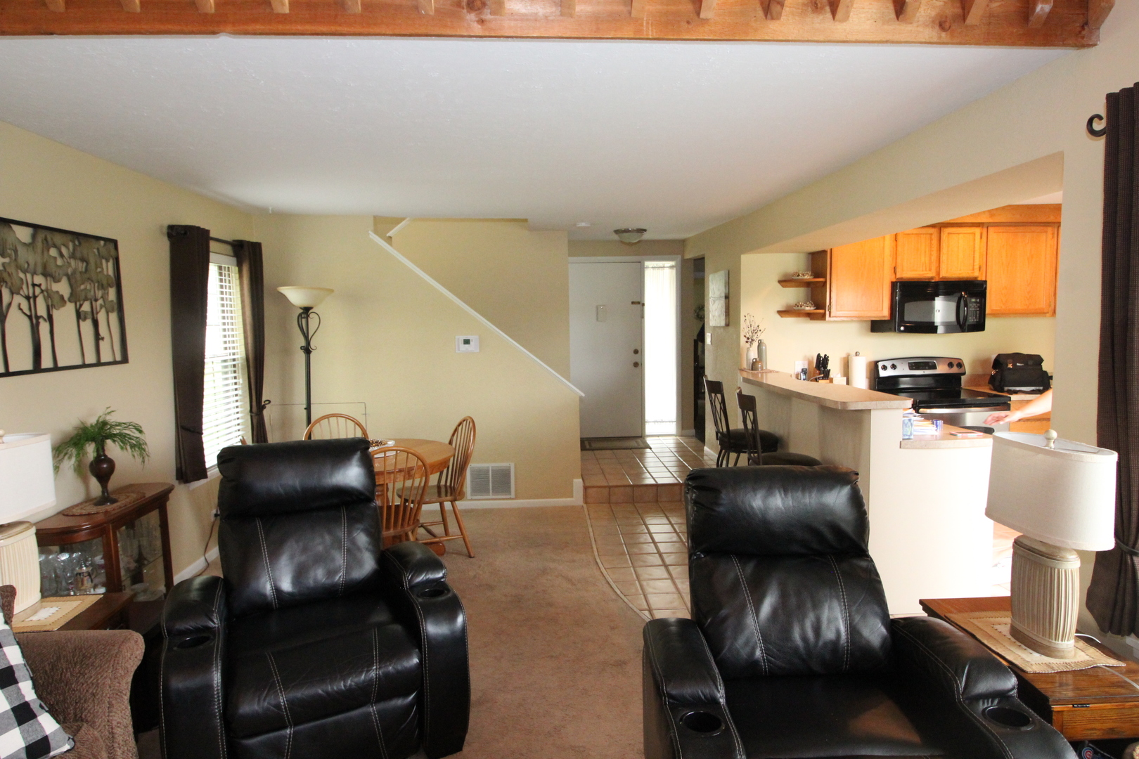 766 Chandler Road Gurnee, IL 60031 - Photo 4 of 24 a dining room with furniture and wooden floor