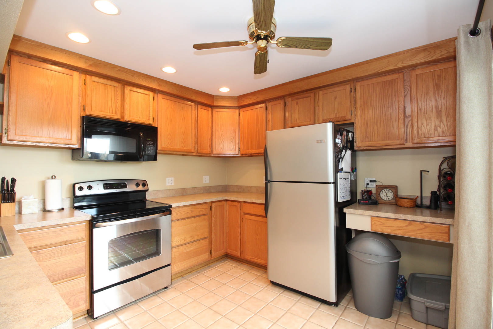 766 Chandler Road Gurnee, IL 60031 - Photo 6 of 24 a kitchen with stainless steel appliances a refrigerator stove and microwave