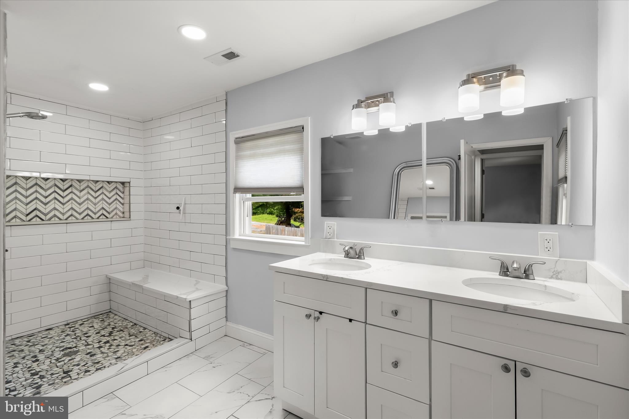 14213 Longnecker Road Reisterstown, MD 21136 - Photo 17 of 44 a bathroom with a sink a toilet and mirror