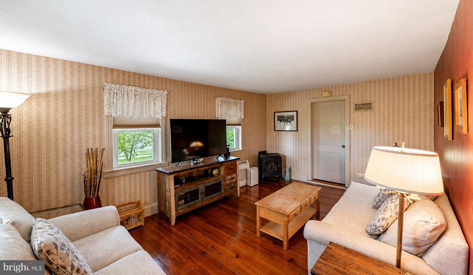 222 Blue School Road Perkasie, PA 18944 - Photo 20 of 77 a living room with furniture and a flat screen tv