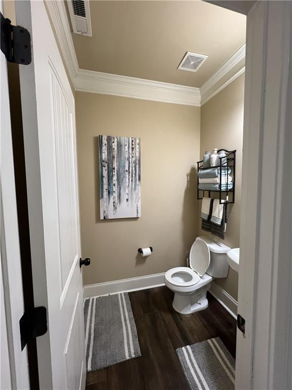 140 Providence Parkway Covington, GA 30014 - Photo 14 of 24 a bathroom with a toilet and a mirror