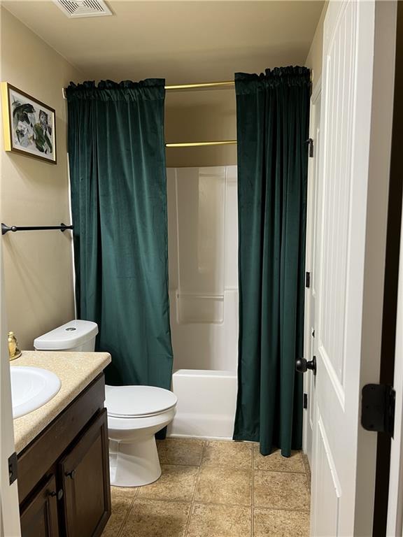 140 Providence Parkway Covington, GA 30014 - Photo 15 of 24 a bathroom with a toilet a sink and shower