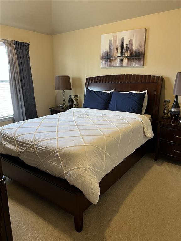140 Providence Parkway Covington, GA 30014 - Photo 17 of 24 a bedroom with a bed and wooden floor