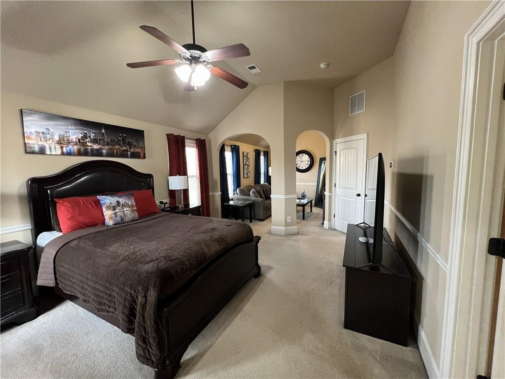 140 Providence Parkway Covington, GA 30014 - Photo 18 of 24 a spacious bedroom with a bed and ceiling fan