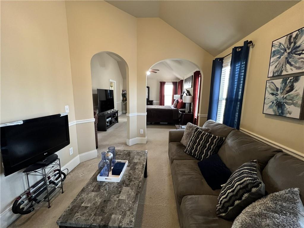 140 Providence Parkway Covington, GA 30014 - Photo 19 of 24 a living room with furniture and a flat screen tv