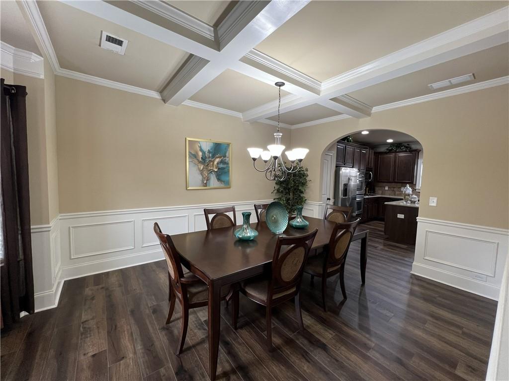 140 Providence Parkway Covington, GA 30014 - Photo 9 of 24 a view of a dining room with furniture and wooden floor