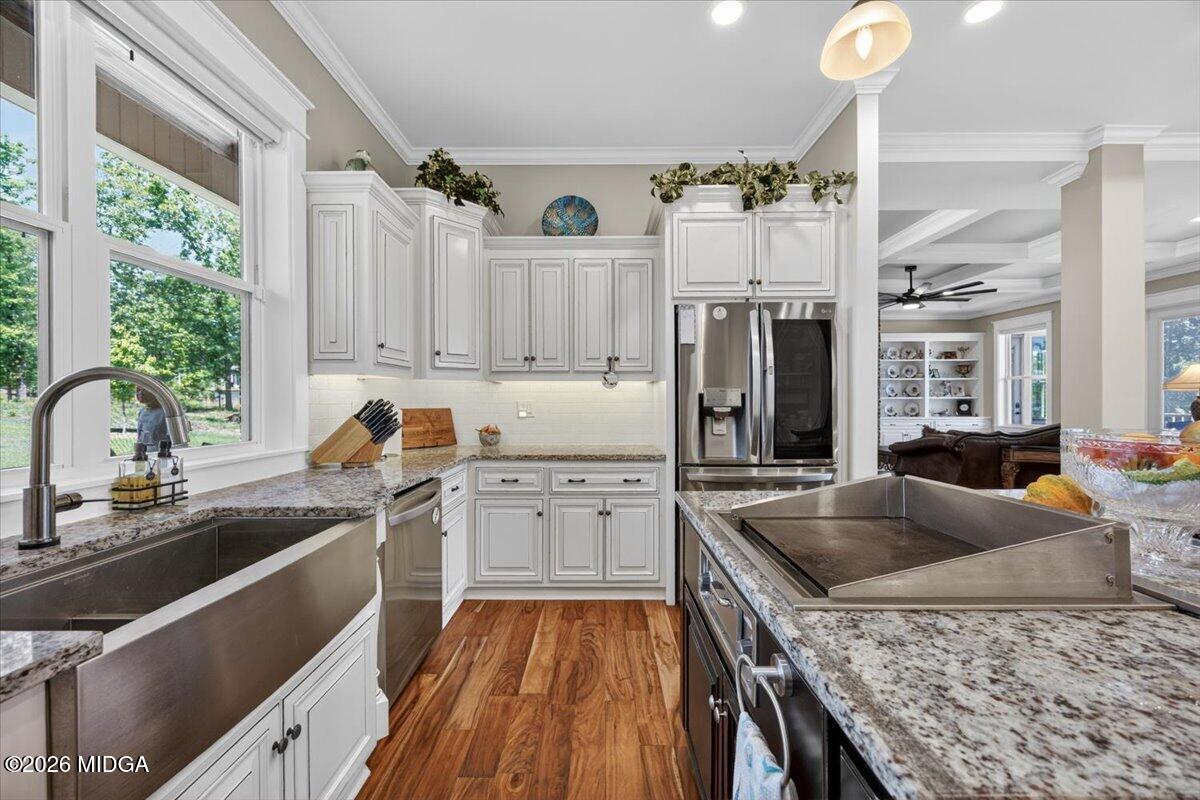 7287 Moseley Dixon Road Macon, GA 31220 - Photo 14 of 83 a kitchen that has a sink cabinets counter space and appliances
