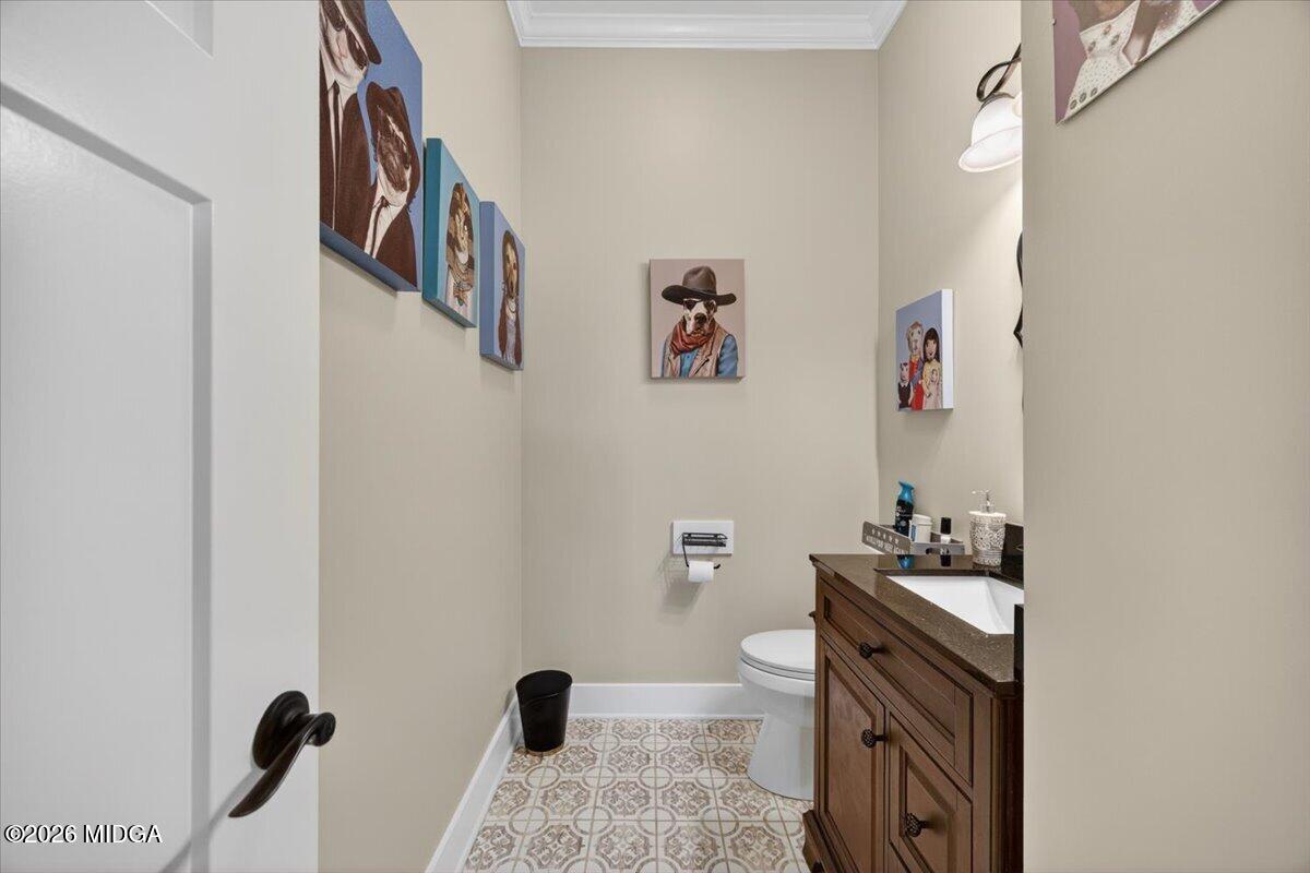 7287 Moseley Dixon Road Macon, GA 31220 - Photo 20 of 83 a bathroom with a sink toilet and vanity