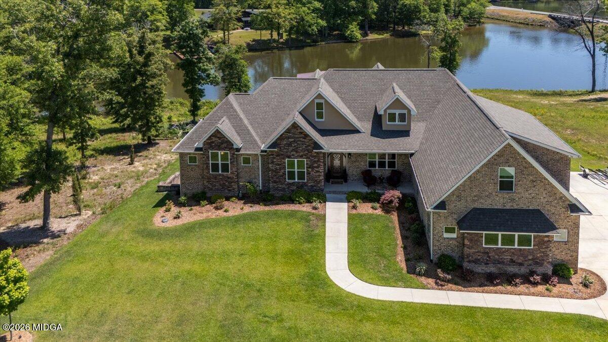 7287 Moseley Dixon Road Macon, GA 31220 - Photo 2 of 83 a aerial view of a house with swimming pool and a yard