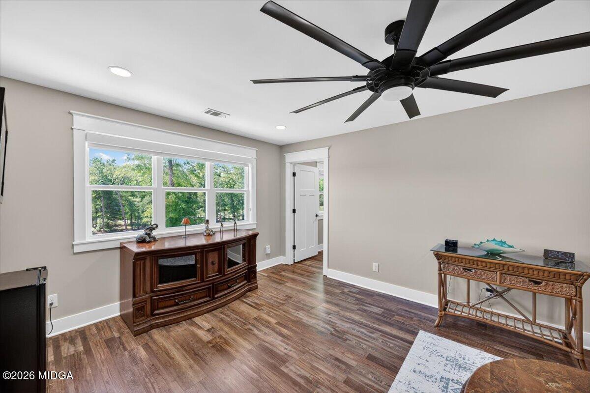 7287 Moseley Dixon Road Macon, GA 31220 - Photo 32 of 83 a living room with stainless steel appliances wooden floor and a window