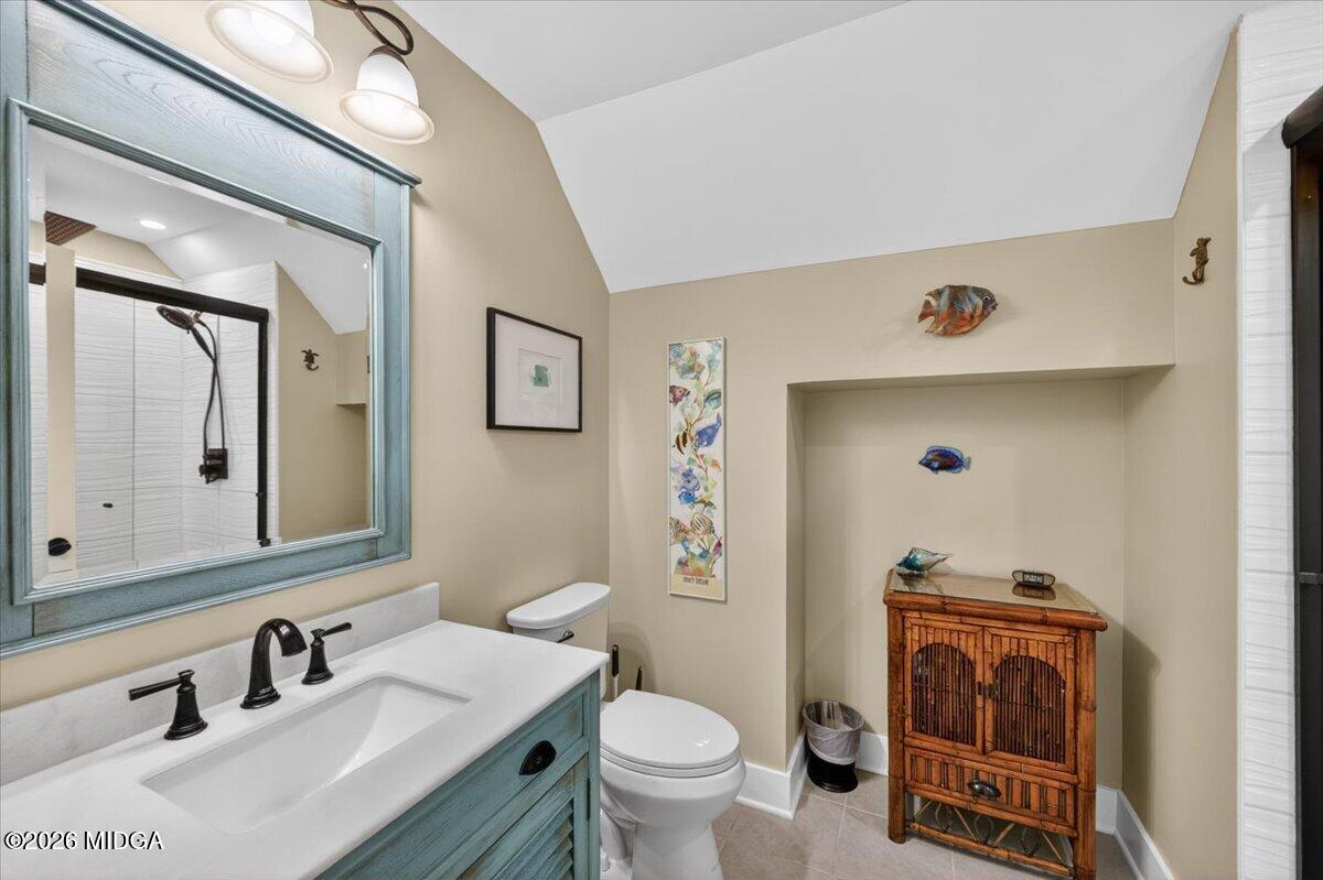7287 Moseley Dixon Road Macon, GA 31220 - Photo 33 of 83 a bathroom with a sink a toilet and mirror