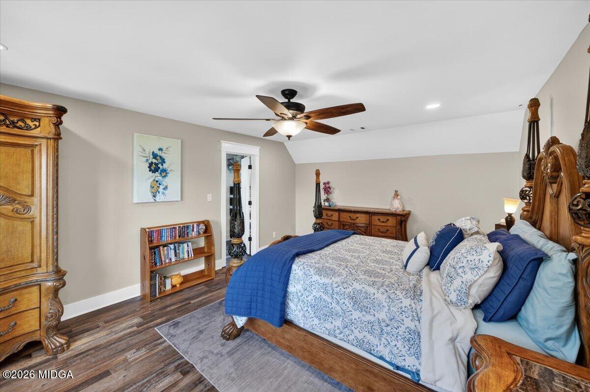 7287 Moseley Dixon Road Macon, GA 31220 - Photo 35 of 83 a bedroom with a bed and a ceiling fan