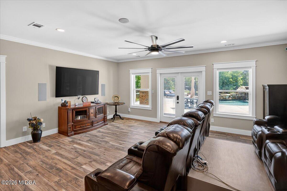 7287 Moseley Dixon Road Macon, GA 31220 - Photo 40 of 83 a living room with furniture and a flat screen tv