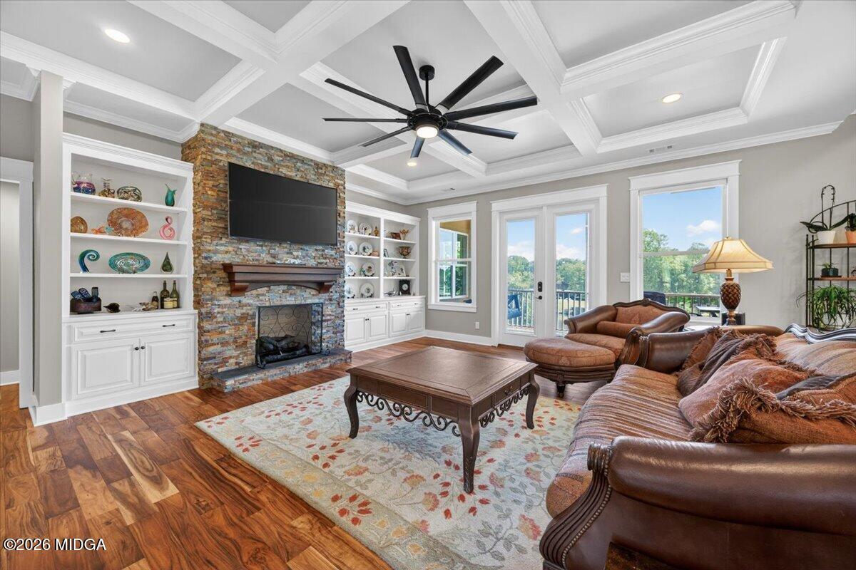 7287 Moseley Dixon Road Macon, GA 31220 - Photo 4 of 83 a living room with fireplace furniture and a flat screen tv