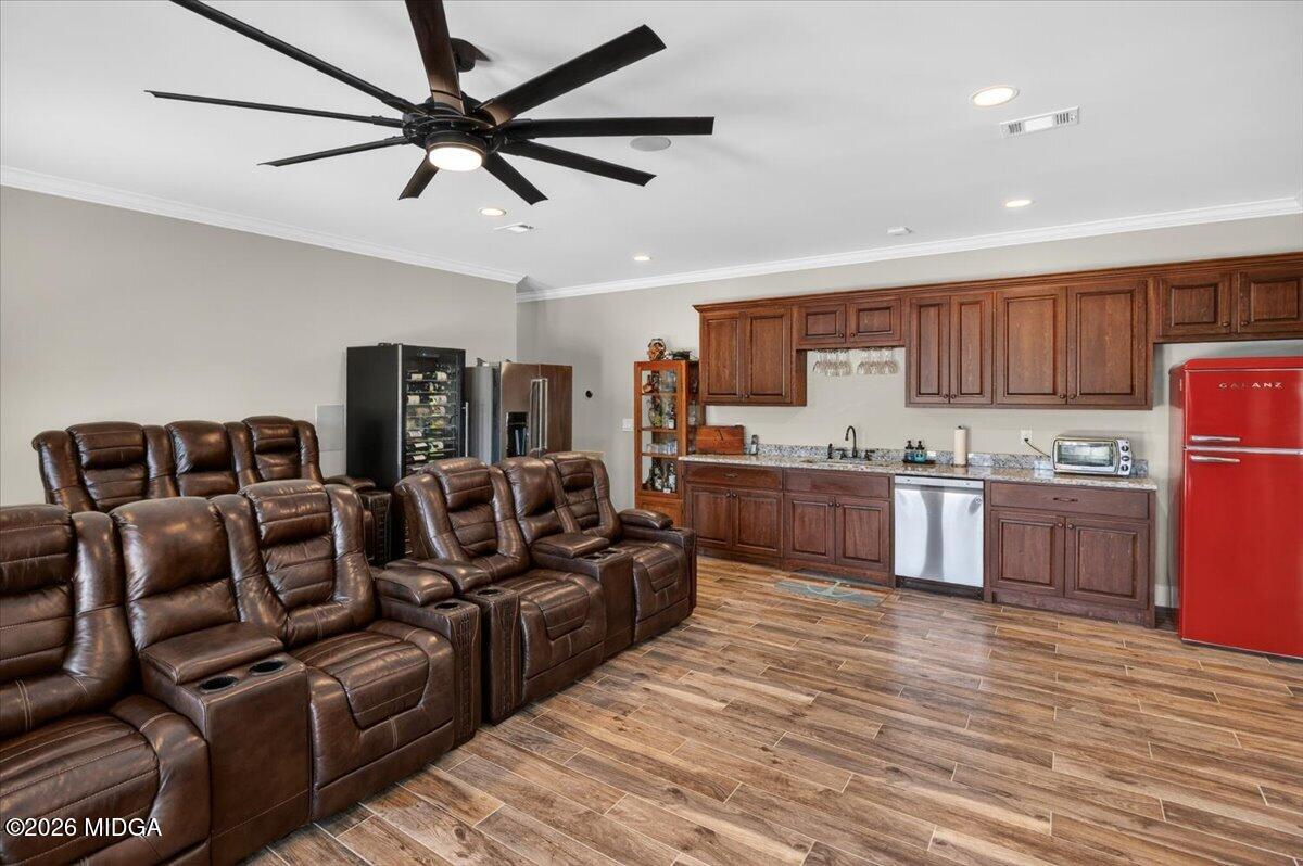 7287 Moseley Dixon Road Macon, GA 31220 - Photo 42 of 83 a living room with stainless steel appliances kitchen island granite countertop a couch and a view of kitchen