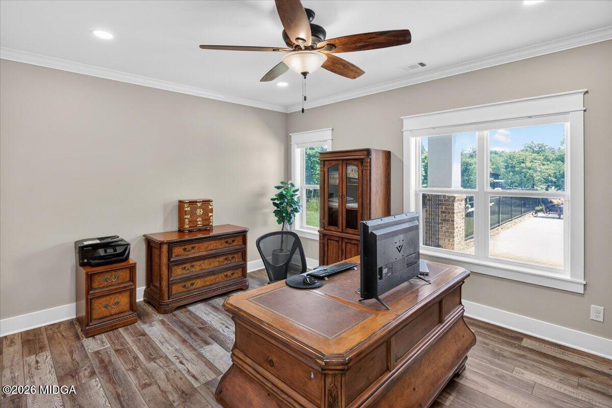7287 Moseley Dixon Road Macon, GA 31220 - Photo 43 of 83 a living room with furniture a flat screen tv and a floor to ceiling window