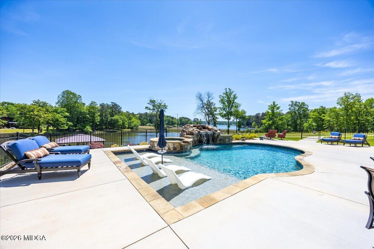 7287 Moseley Dixon Road Macon, GA 31220 - Photo 56 of 83 a view of a patio with couches and table and chairs and potted plants