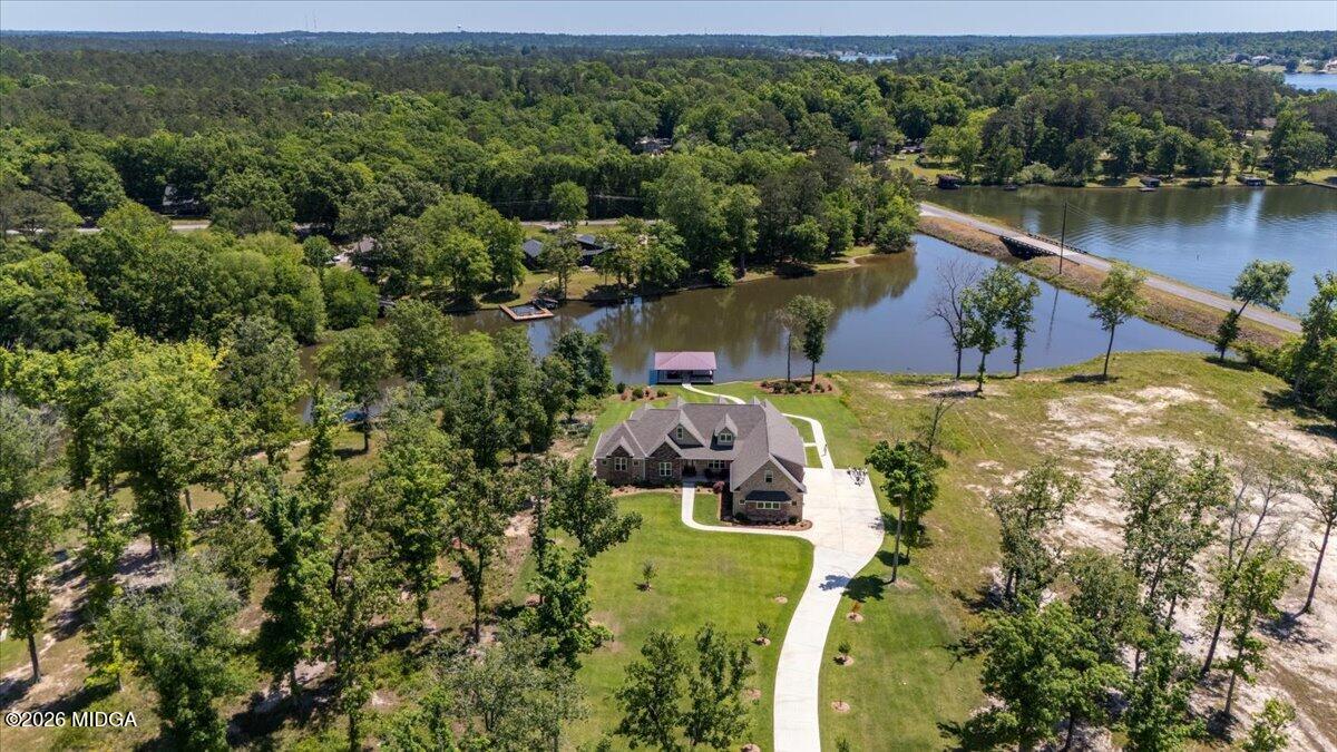 7287 Moseley Dixon Road Macon, GA 31220 - Photo 66 of 83 an aerial view of a house with a yard and lake view