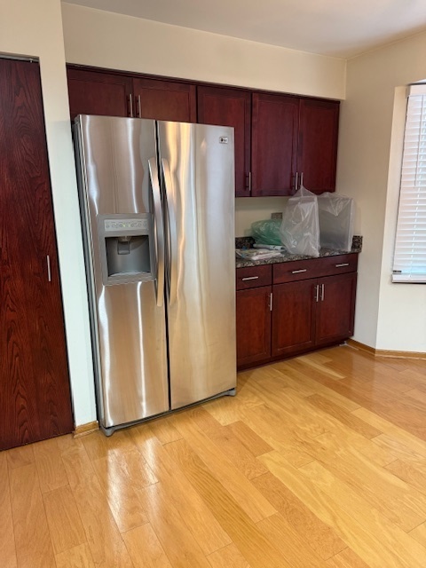 1575 Buckthorn Drive Hoffman Estates, IL 60192 - Photo 3 of 6 a kitchen with granite countertop a refrigerator and a sink