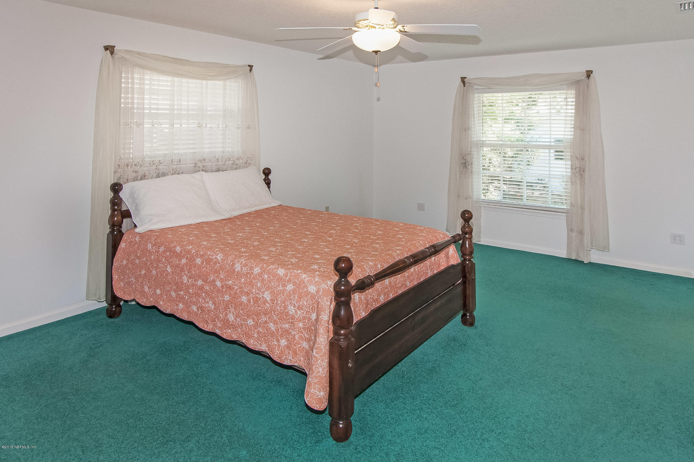75109 Edwards Road Yulee, FL 32097 - Photo 12 of 30 a bed sitting in a room next to a window