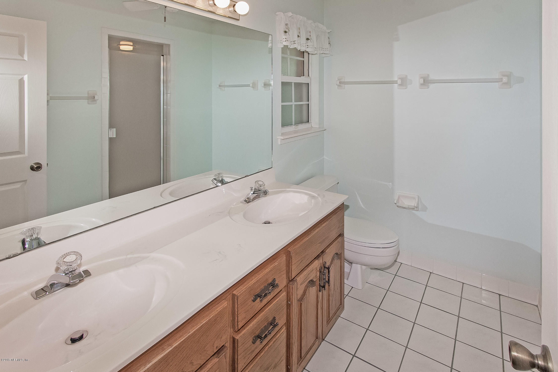 75109 Edwards Road Yulee, FL 32097 - Photo 13 of 30 a bathroom with a sink toilet and shower