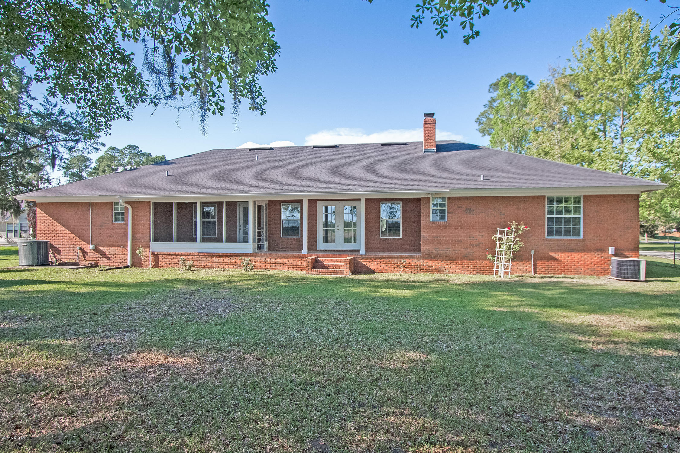 75109 Edwards Road Yulee, FL 32097 - Photo 21 of 30 a front view of a house with a yard