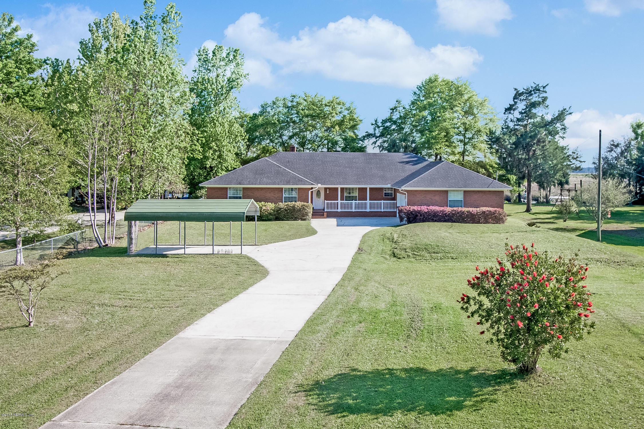 75109 Edwards Road Yulee, FL 32097 - Photo 29 of 30 a view of house with garden space and trees