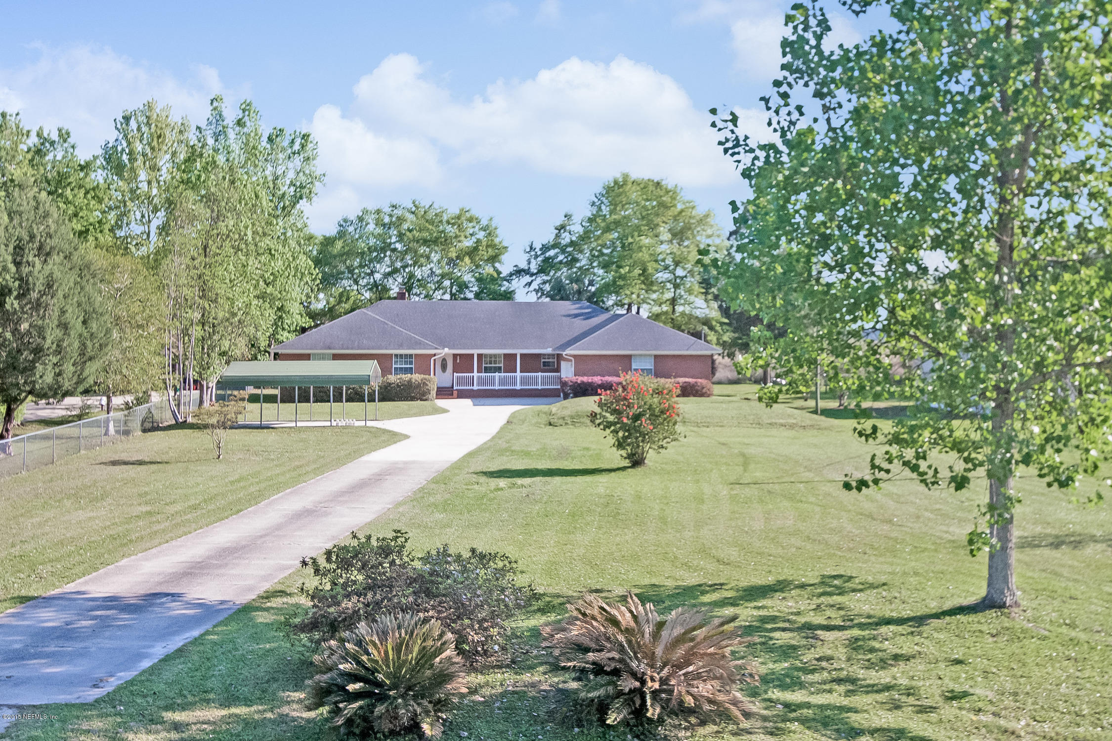 75109 Edwards Road Yulee, FL 32097 - Photo 30 of 30 a view of a house with a yard