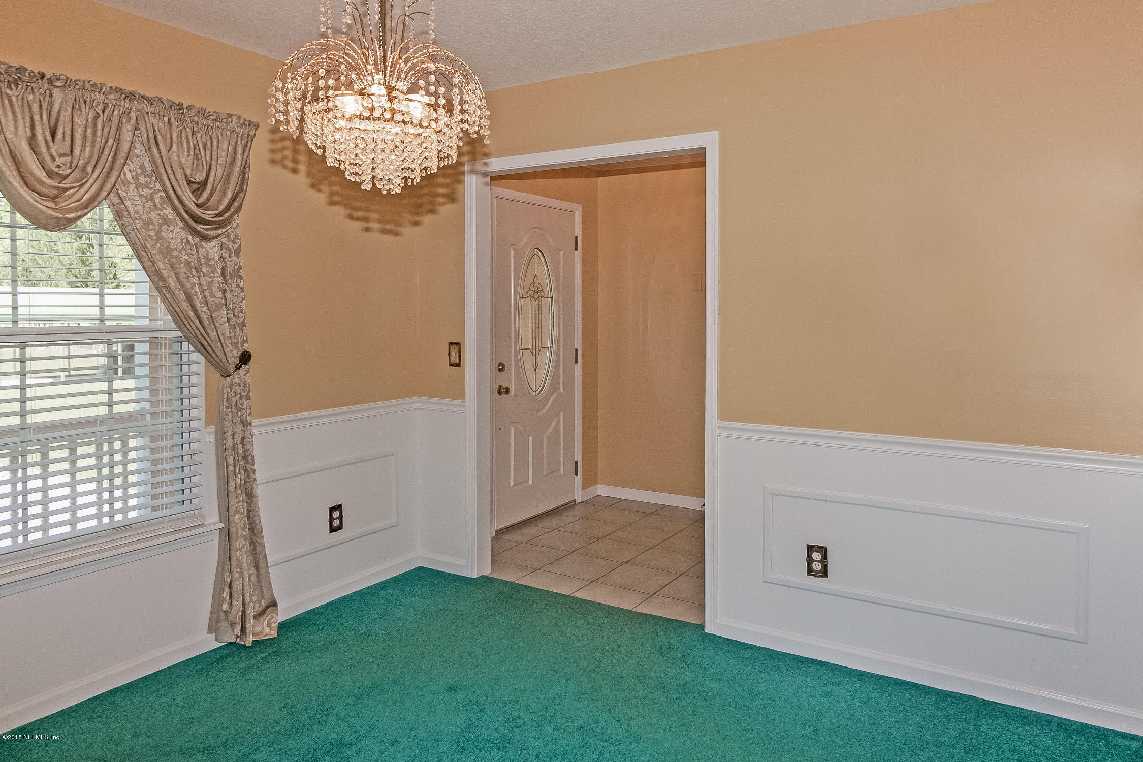 75109 Edwards Road Yulee, FL 32097 - Photo 4 of 30 a view of a chandelier in big room with chandelier