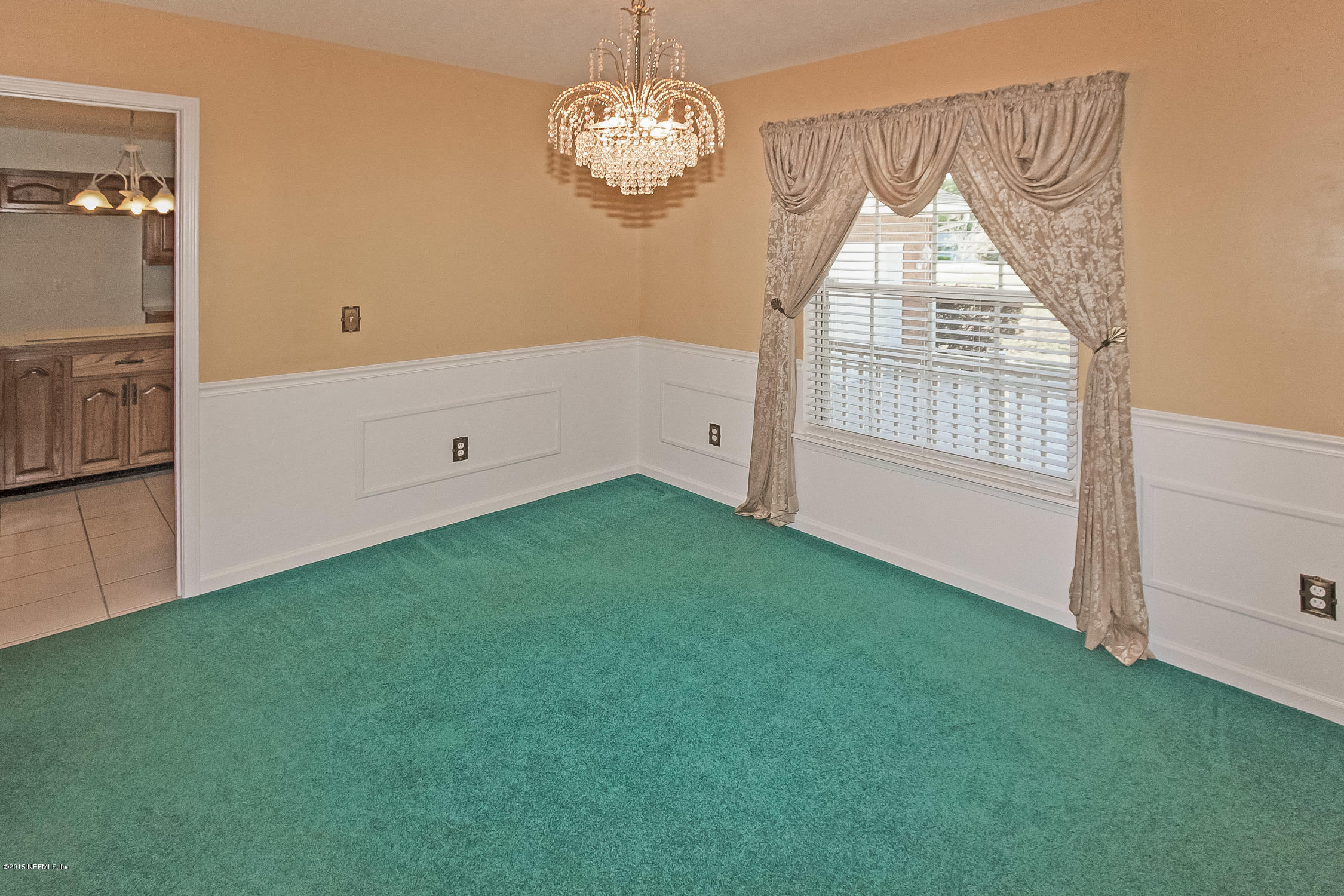 75109 Edwards Road Yulee, FL 32097 - Photo 9 of 30 a view of empty room with wooden floor and fan