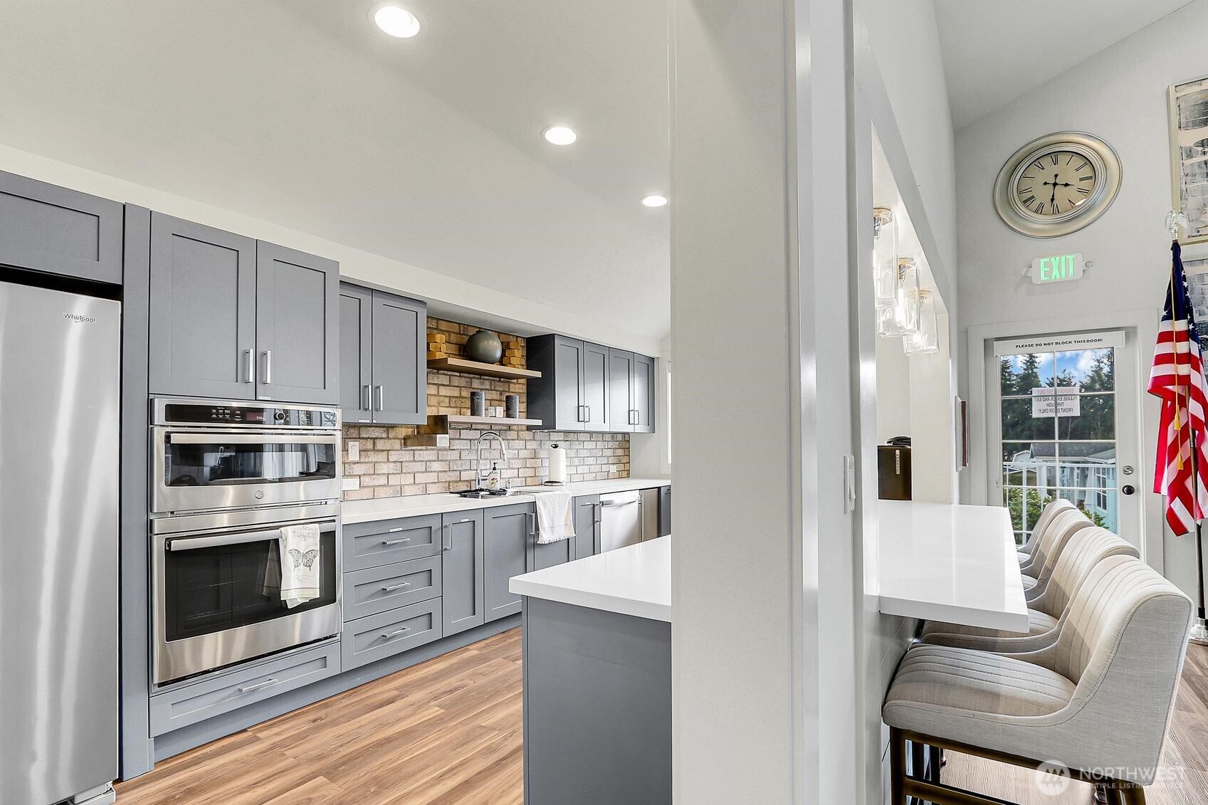 1427 100th Street Southwest, Unit 160 Everett, WA 98204 - Photo 24 of 28 a kitchen with stainless steel appliances granite countertop a refrigerator and a stove top oven