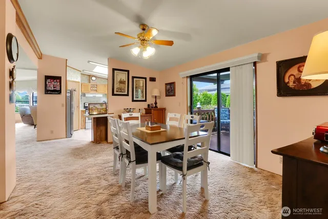 a view of a dining room with furniture and a livingroom