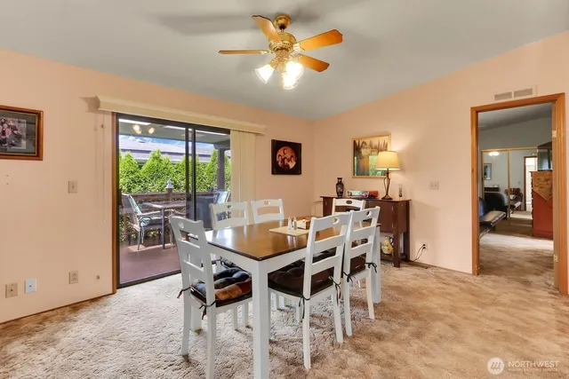 a view of a dining room with furniture and a livingroom
